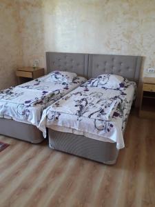 Postel nebo postele na pokoji v ubytování Guesthouse Achi