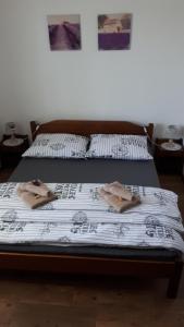 two beds in a room with candles on them at Ubytovanie na súkromí in Veľká Lomnica