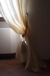 A bed or beds in a room at Agriturismo Il Poggiolo