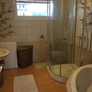 a bathroom with a shower and a sink at Apartment Tekeľova 95m2 in Prešov