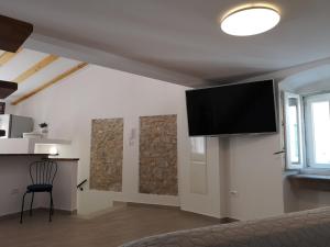 TV a/nebo společenská místnost v ubytování Apartmani Kraj mora
