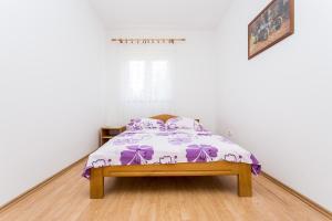 Postel nebo postele na pokoji v ubytování Apartman Justinić