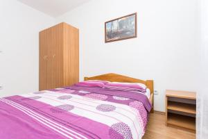 Postel nebo postele na pokoji v ubytování Apartman Justinić