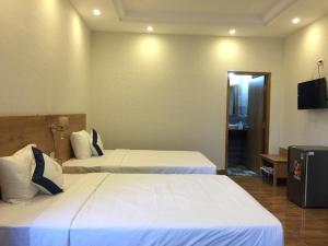 Giường trong phòng chung tại Thanh Truc Hotel Ca Mau