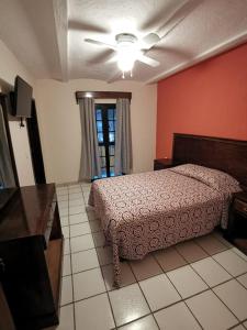 Postel nebo postele na pokoji v ubytování Hotel Boutique Real Tequila