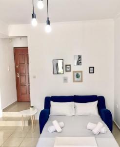 a bedroom with a bed with two pillows on it at Minimal Apartment Center Kavala in Kavála