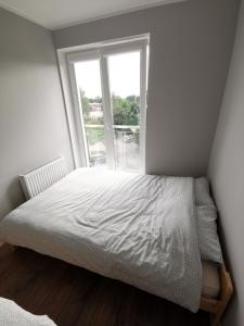 Posteľ alebo postele v izbe v ubytovaní Apartament Cyprys 2