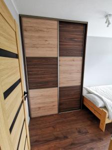 Posteľ alebo postele v izbe v ubytovaní Apartament Cyprys 2