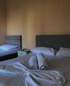 Uma cama ou camas num quarto em Hotel Athina