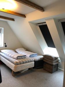 En eller flere senge i et værelse på Stort hus nær Rømø