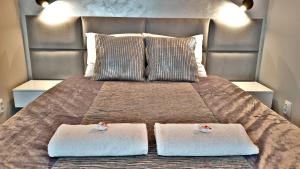 Postel nebo postele na pokoji v ubytování Marine Gardenia Seaside