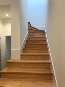 a staircase in a house with wooden floors at MyTrip Porto in Matosinhos