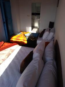 Postel nebo postele na pokoji v ubytování Appart, Hotel & Café Agadir