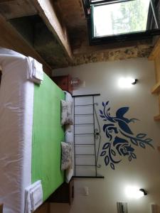 A bed or beds in a room at Hosteria Calixtino