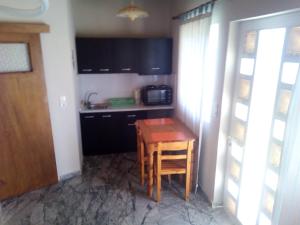 Kuchyň nebo kuchyňský kout v ubytování Summertime Apartments