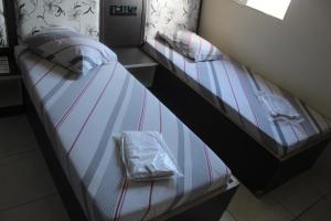 Postel nebo postele na pokoji v ubytování Hotel Cumbica Guarulhos