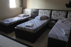 Postel nebo postele na pokoji v ubytování Hotel Cumbica Guarulhos