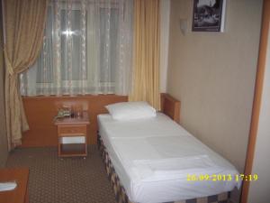 Postel nebo postele na pokoji v ubytování Saray Hotel