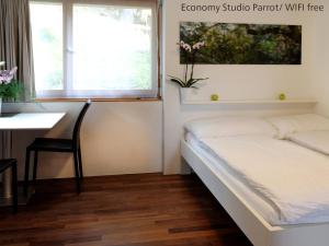 Ένα ή περισσότερα κρεβάτια σε δωμάτιο στο Zermatt Appartements