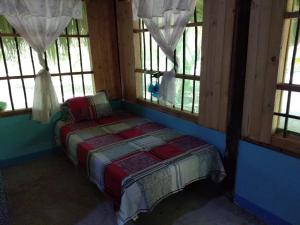 Postel nebo postele na pokoji v ubytování Ecohotel Arte y Aventura
