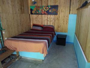 Postel nebo postele na pokoji v ubytování Ecohotel Arte y Aventura