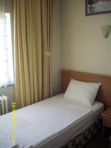Postel nebo postele na pokoji v ubytování Saray Hotel