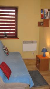 Posteľ alebo postele v izbe v ubytovaní Widokowy apartament Bór