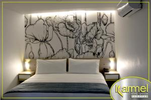 Letto o letti in una camera di Hotel Karmel