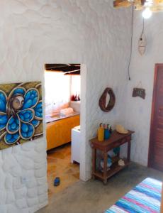 a room with a room with a bed and a table at Flats Macapá Meu Amor in Luis Correia