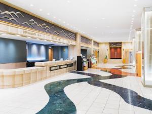 a lobby of a hotel with a pool of water at Hotel New Hankyu Kyoto in Kyoto