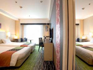 Postel nebo postele na pokoji v ubytování Hotel New Hankyu Kyoto