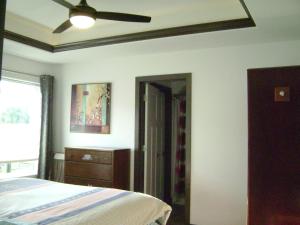 a bedroom with a bed and a ceiling fan at Brand new duplex in Cedar Rapids