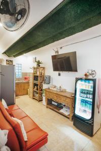a living room with a video game console and a television at Dong Jegeg Canggu in Canggu