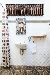 a bathroom with a sink and a mirror at Dong Jegeg Canggu in Canggu +70 photos