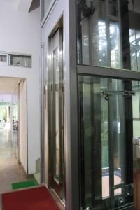 a group of glass doors in a building at QUANG SAIGON Hotel- 40-7 Bùi Viện-Walking street in Ho Chi Minh City
