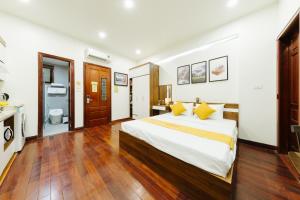 Giường trong phòng chung tại Hi Home Residences Ba Dinh Ha Noi