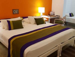 Postelja oz. postelje v sobi nastanitve Hotel Sigiriya