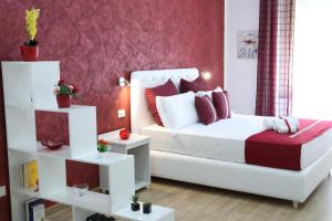 Posteľ alebo postele v izbe v ubytovaní La Terrazza Palace B&B