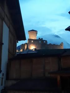 a view of a castle from the roof of a building at Hotel Il Maniero in Ossana