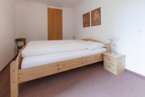 Postel nebo postele na pokoji v ubytování Residenz Alpina 115