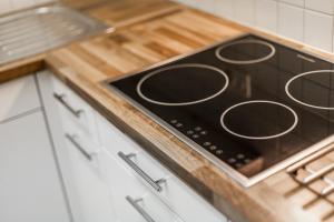 a stove top oven sitting on top of a kitchen counter at Residenz Alpina im Kurhaus in Lenzerheide