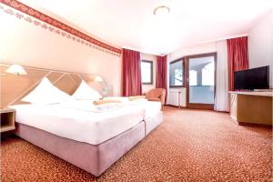 Posteľ alebo postele v izbe v ubytovaní Sporthotel Kühtai