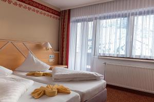 Posteľ alebo postele v izbe v ubytovaní Sporthotel Kühtai