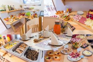 a table with a bunch of breakfast foods on it at Penzion TOP in Český Krumlov