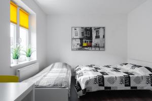 Łóżko lub łóżka w pokoju w obiekcie Stay99