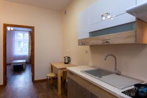 Kuchyň nebo kuchyňský kout v ubytování Apartamenty Galicja + 37 fotografií