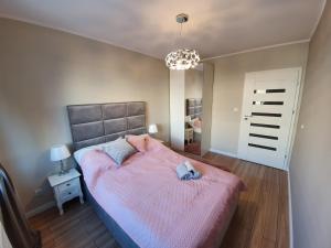 Łóżko lub łóżka w pokoju w obiekcie Apartament Old Town Teczowa