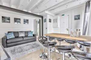 a living room with a couch and a table at 93 - Luxury Flat in Le Marais in Paris