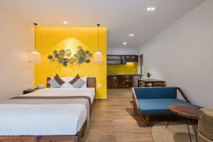 Postel nebo postele na pokoji v ubytování December Hoi An Villa