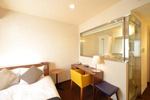 Posteľ alebo postele v izbe v ubytovaní Oriental Hotel Hiroshima